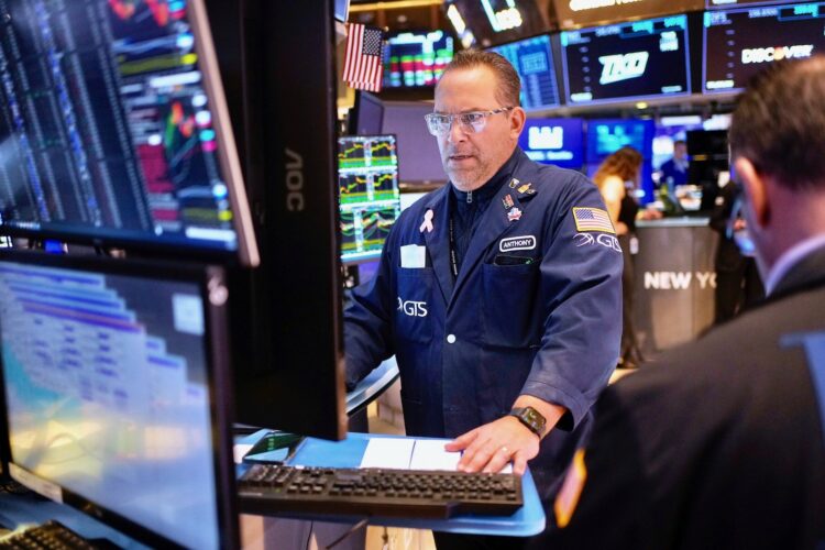 Stock market today: Wall Street slips, but remains on path to snap a weekly losing streak